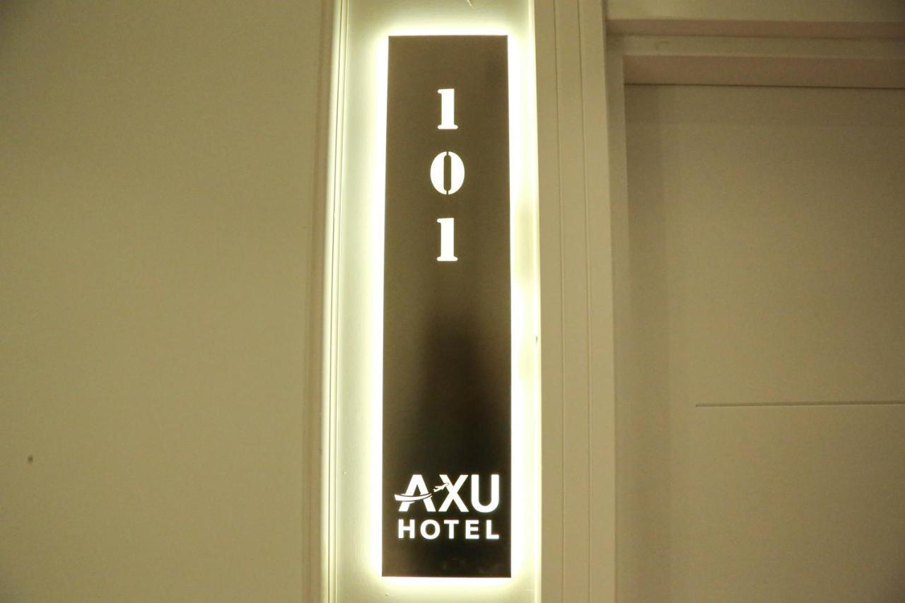 Axu Airport Hotel Arnavutkoy Eksteriør bilde A room sign at Axu Hotel